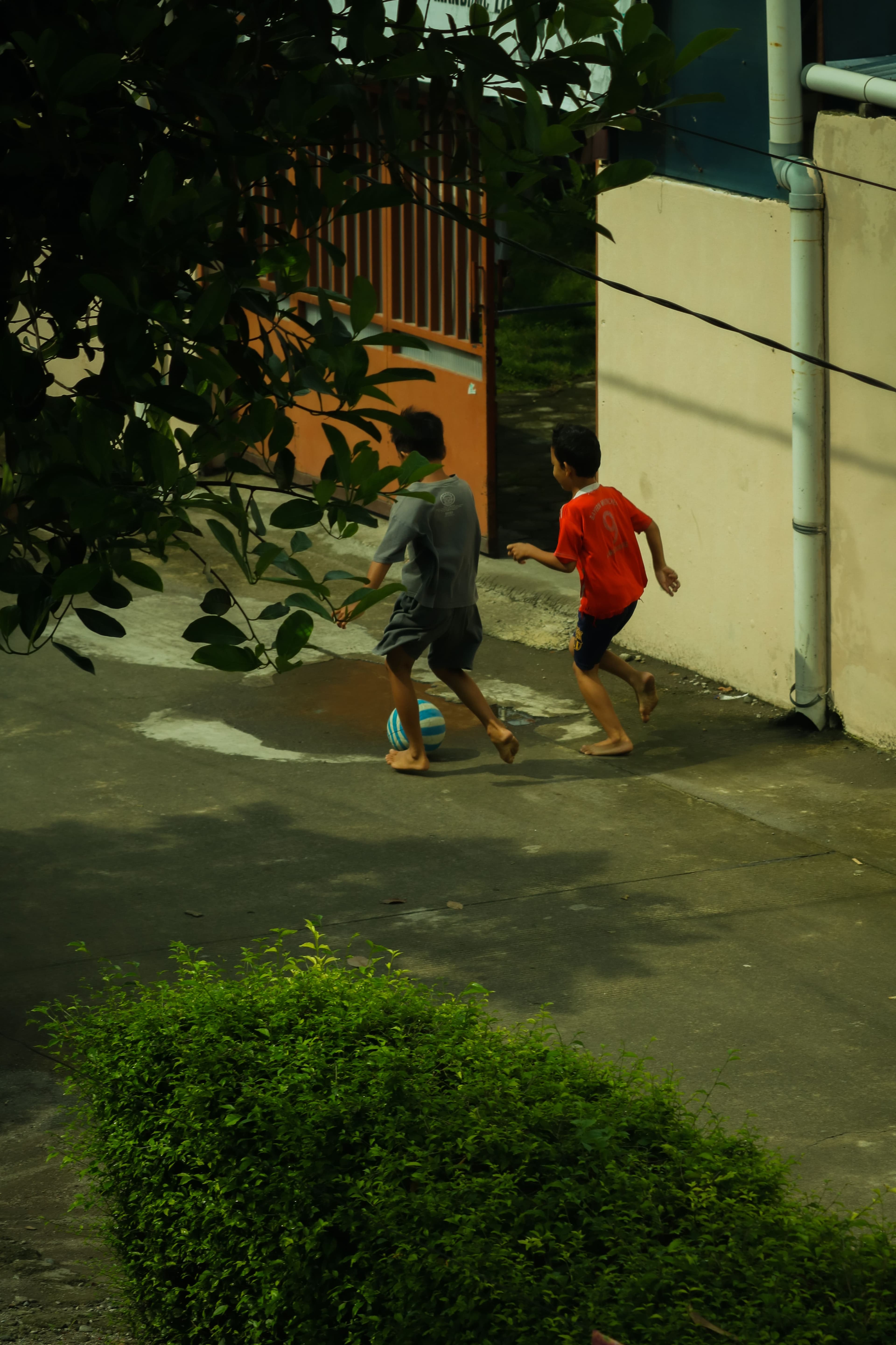 Children playing ball in the village