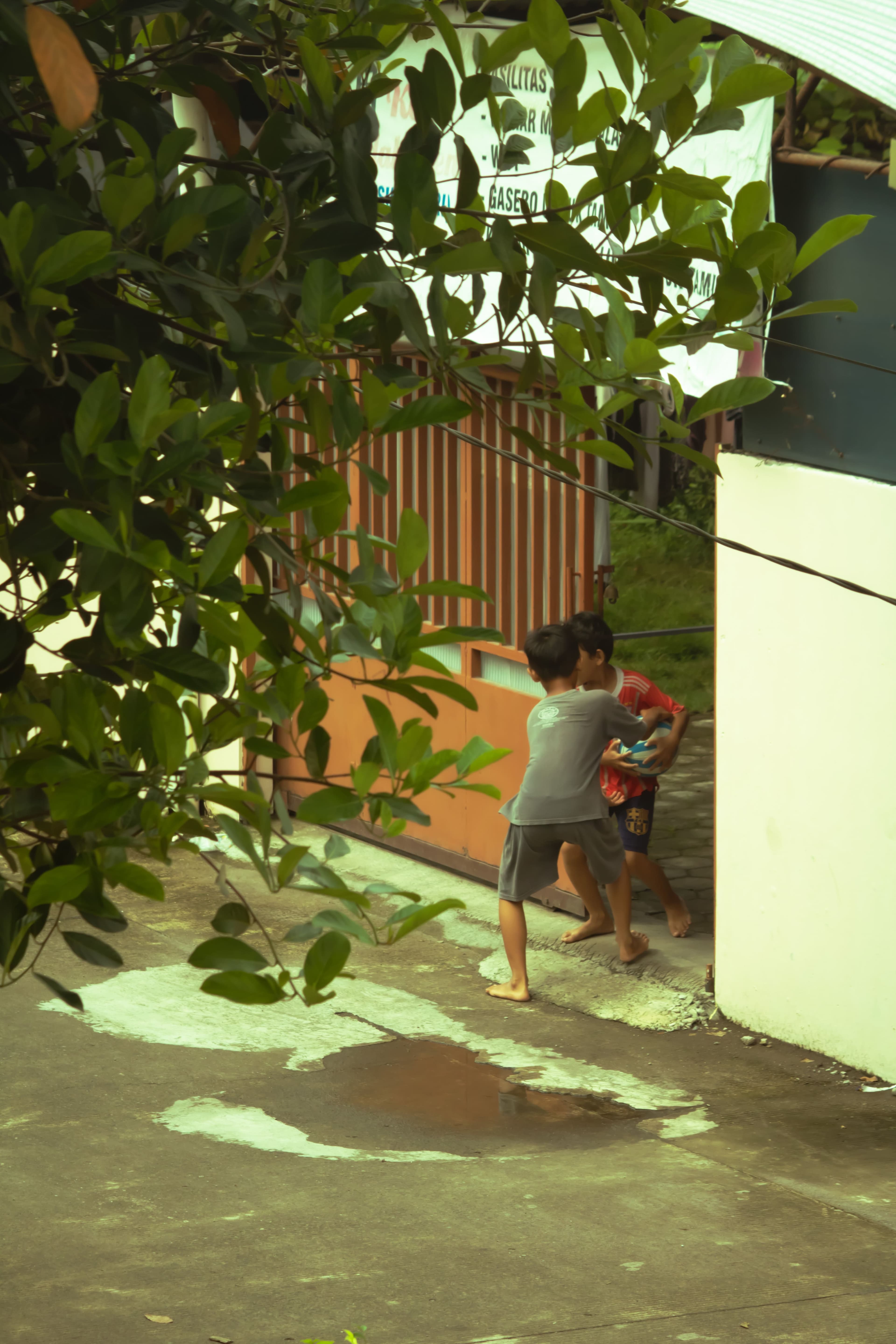 Children playing ball in the village