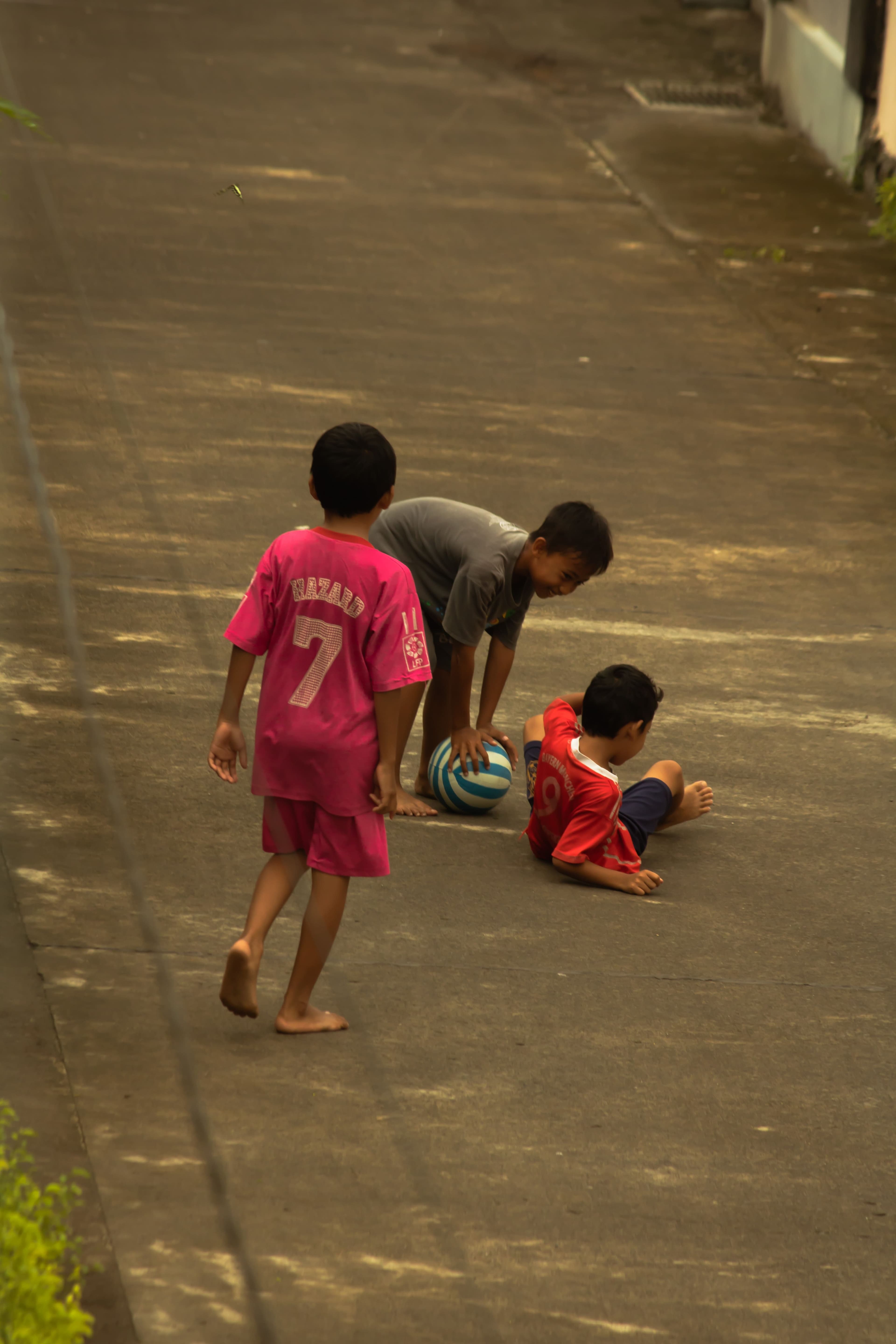 Children playing ball in the village